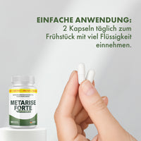 Thumbnail for Hand hält zwei Kapseln vor Metarise Forte Dose Hinweis 2 Kapseln täglich einnehmen