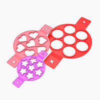 Thumbnail for Drei bunte Silikonformen in Rot Rosa und Lila mit runden herzförmigen und sternförmigen